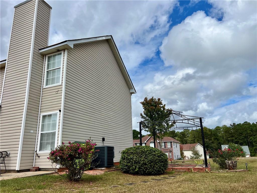 509 Vaughan Valley View Hampton, GA 30228 - Photo 34 of 38 a view of a house with a yard