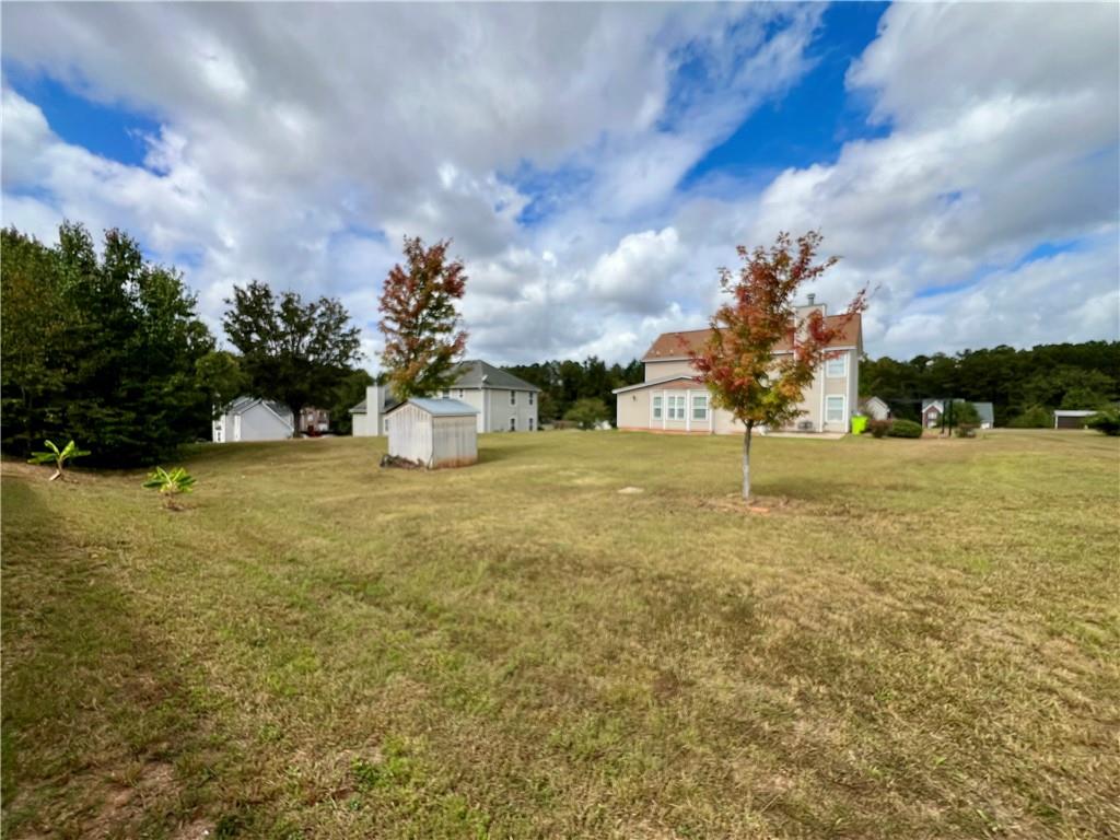 509 Vaughan Valley View Hampton, GA 30228 - Photo 37 of 38 a view of a fountain in front of a house with a yard