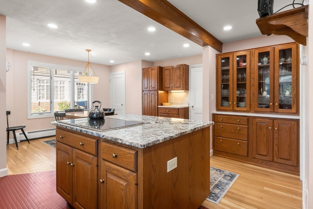 7 Fairfield Street Salem, MA 01970 - Photo 18 of 34 a kitchen with stainless steel appliances granite countertop a sink stove and cabinets