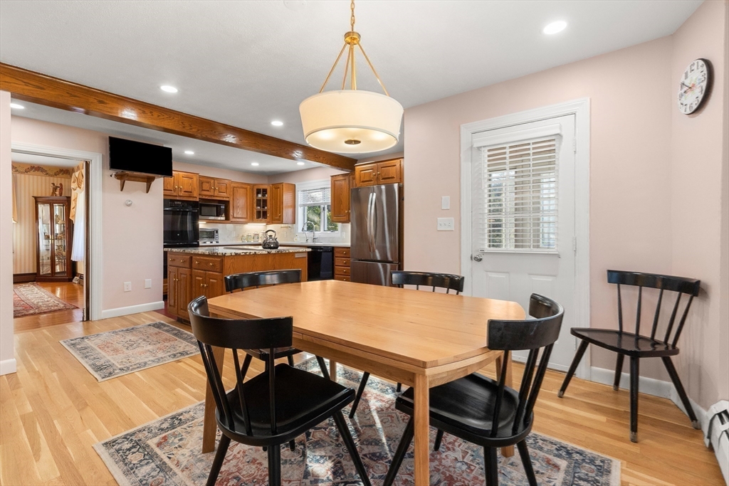 7 Fairfield Street Salem, MA 01970 - Photo 19 of 34 a view of a dining room with furniture and a chandelier