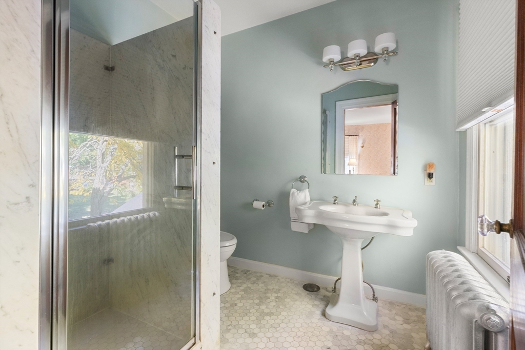 7 Fairfield Street Salem, MA 01970 - Photo 31 of 34 a bathroom with a toilet a sink and mirror