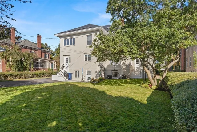 a view of a house with a yard