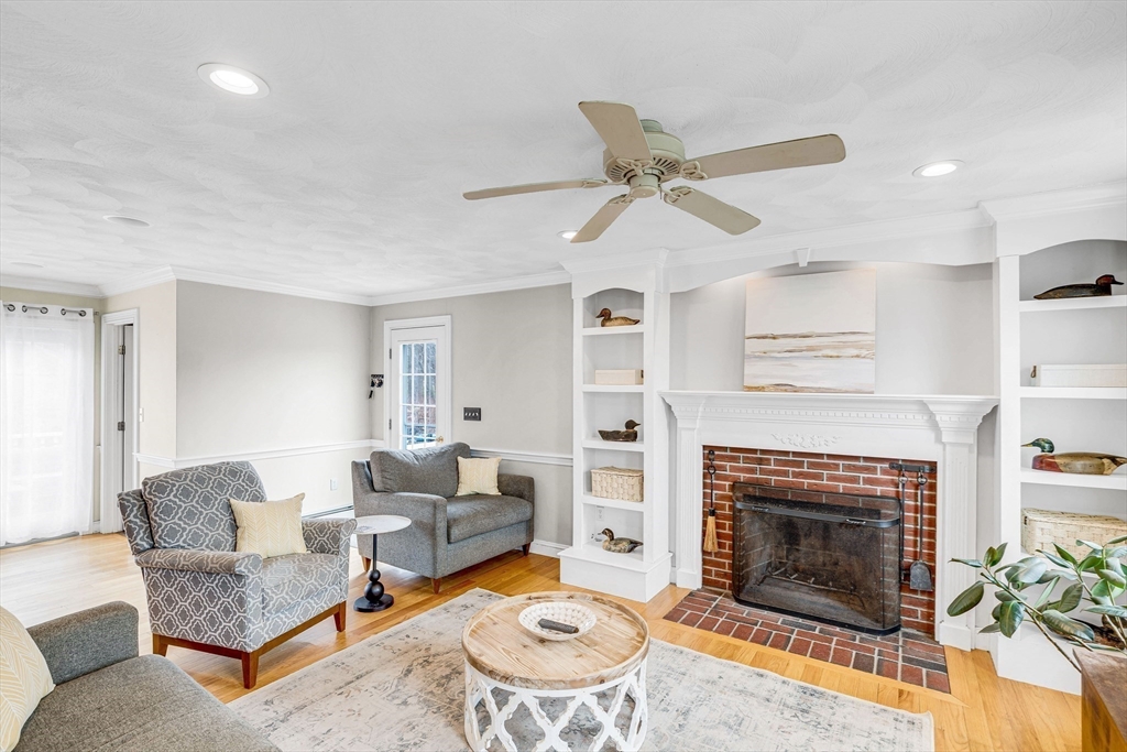 54 Old Merrill Street Amesbury, MA 01913 - Photo 7 of 34 a living room with furniture and a fireplace