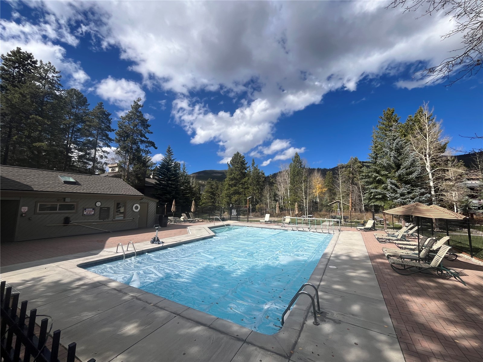 1937 Soda Ridge Road, Unit 1159 Keystone, CO 80435 - Photo 28 of 29 Community pool with a patio area