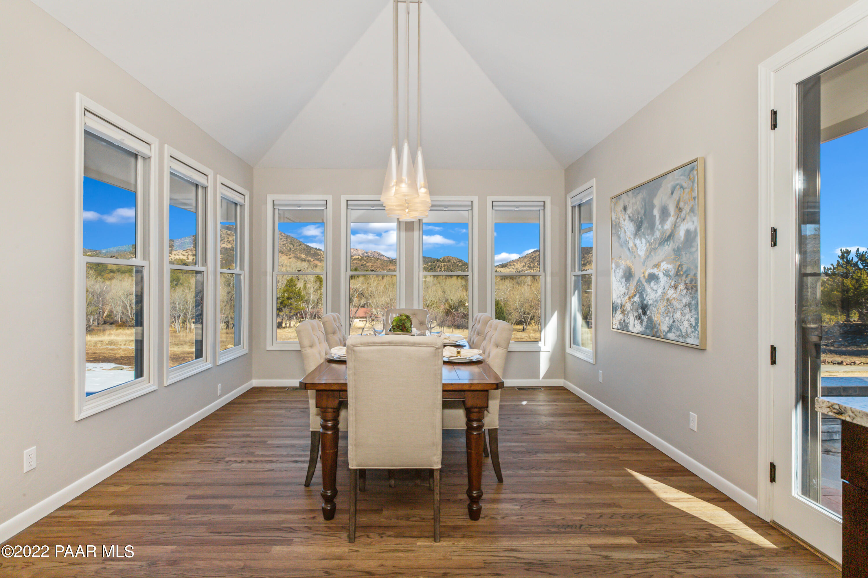 3000 Shadow Valley Ranch Road Prescott, AZ 86305 - Photo 17 of 54 a view of a dining room with furniture large window and wooden floor