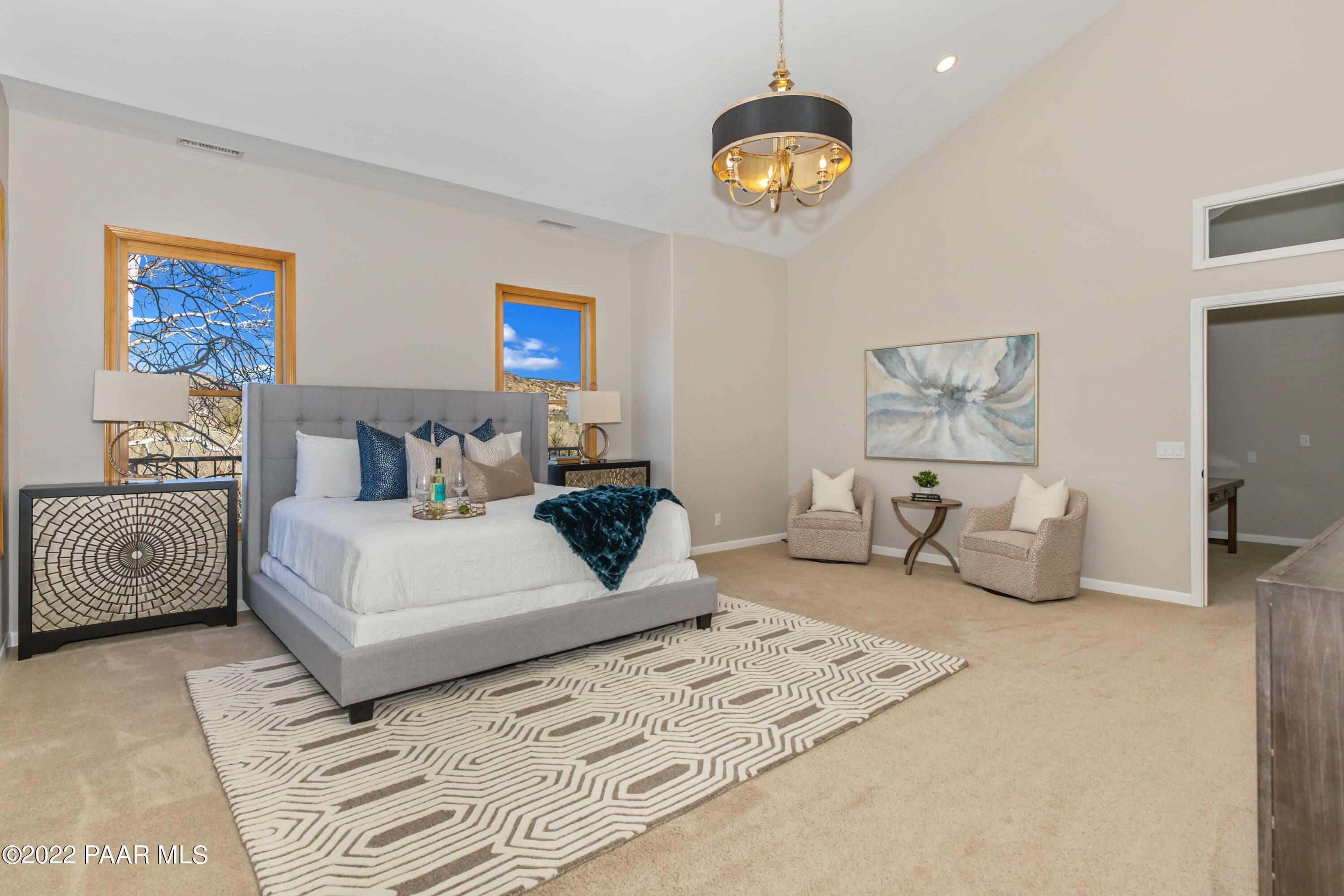 3000 Shadow Valley Ranch Road Prescott, AZ 86305 - Photo 29 of 54 a bedroom with a bed and a chandelier