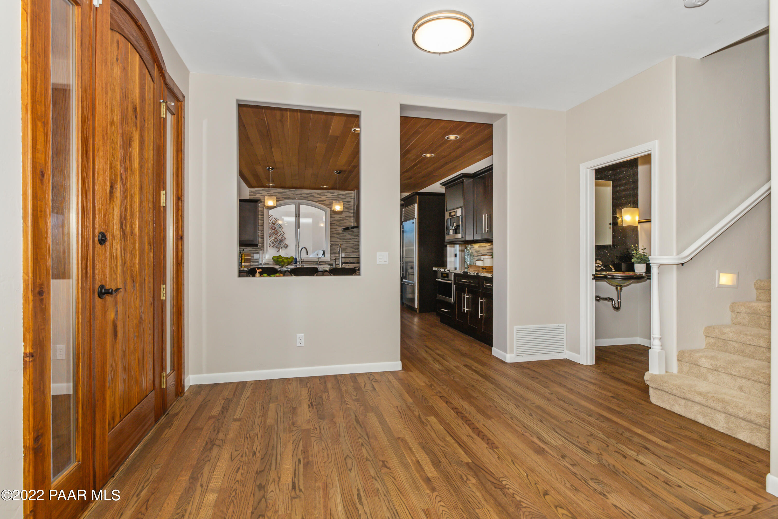 3000 Shadow Valley Ranch Road Prescott, AZ 86305 - Photo 9 of 54 a view of a hallway with wooden floor and furniture