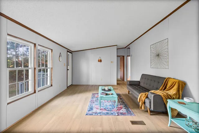 a living room with furniture and window