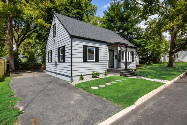 a view of house with backyard