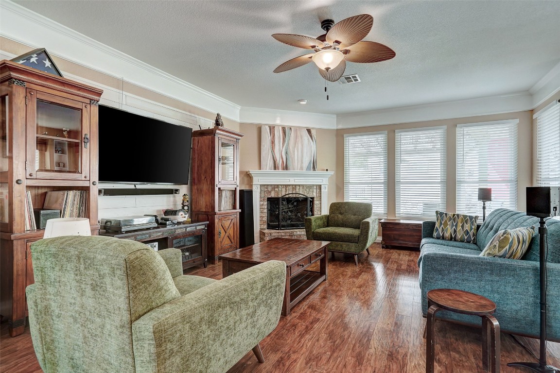 a living room with furniture fireplace and a flat screen tv
