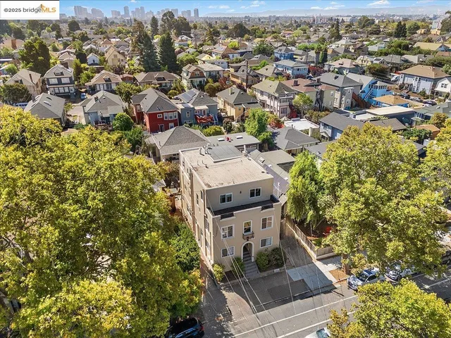 an aerial view of residential houses with outdoor space
