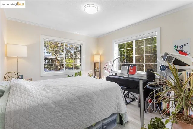 a bedroom with furniture and a window