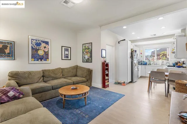 a living room with furniture a rug and a large window