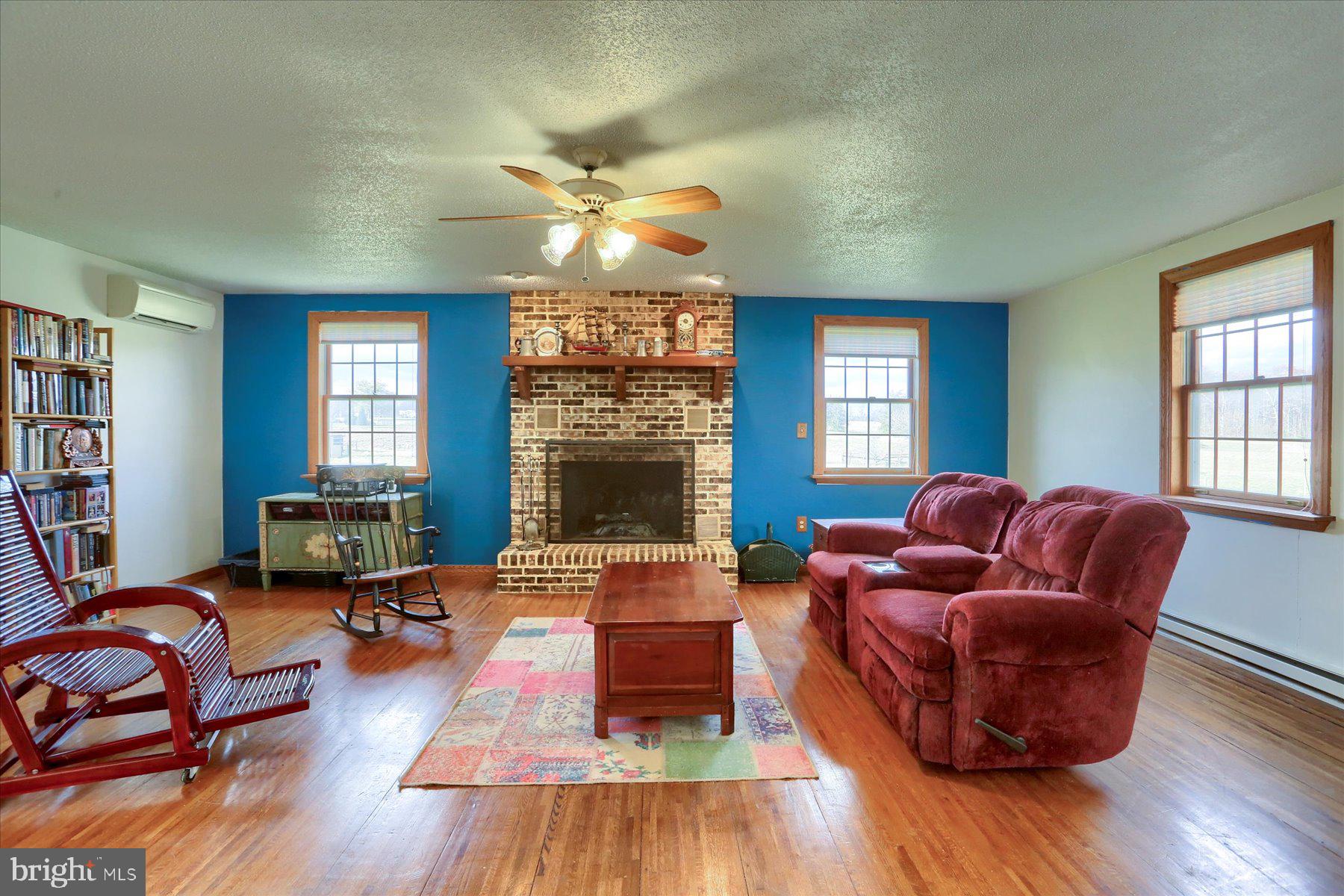 1014 Pondtown Road Dillsburg, PA 17019 - Photo 12 of 42 a living room with furniture fireplace and window