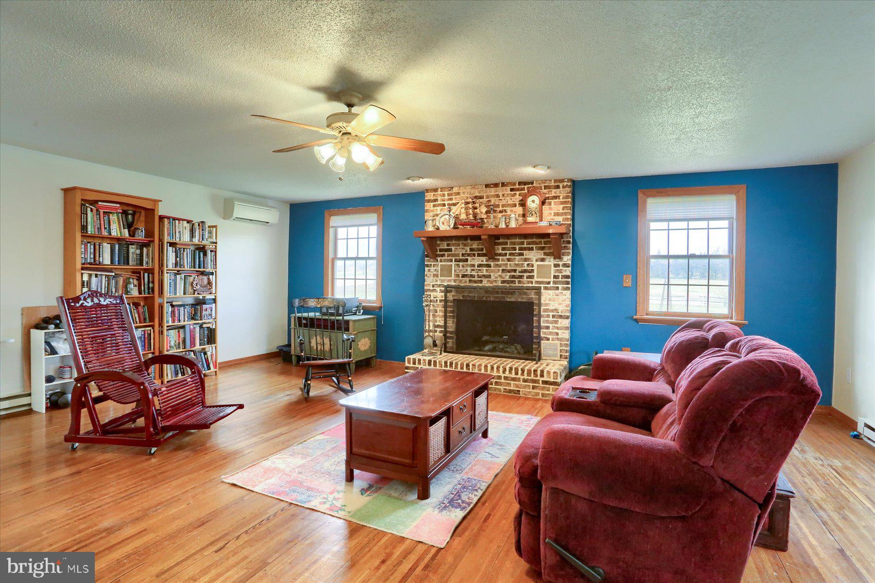 1014 Pondtown Road Dillsburg, PA 17019 - Photo 13 of 42 a living room with furniture a fireplace and a window