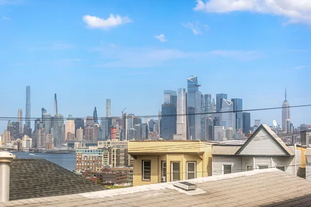 a view of city with tall buildings