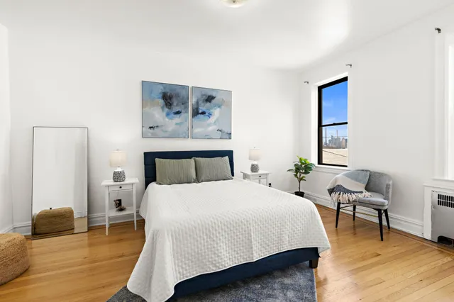 a bedroom with a bed and a couch