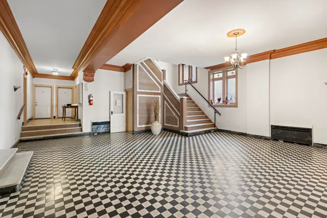 a view of a hallway with stairs