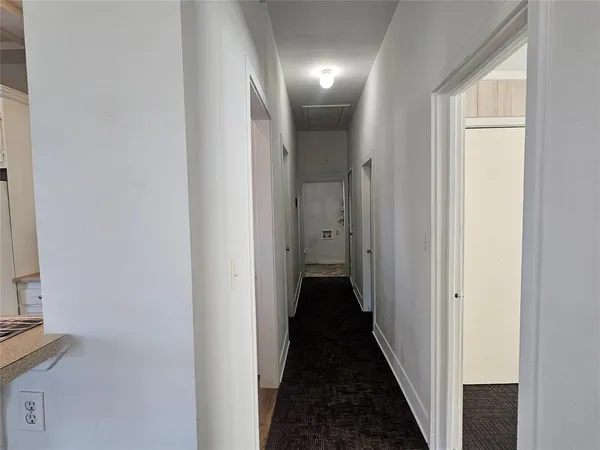 a view of a bathroom from the hallway