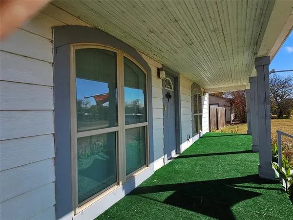 a view of a porch in front of a house