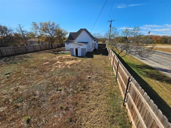 a roof view of a house with a yard
