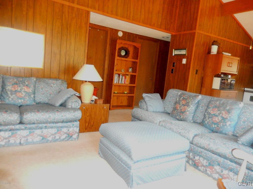 6122 Decker Road Bushkill, PA 18324 - Photo 11 of 33 a living room with furniture and a lamp