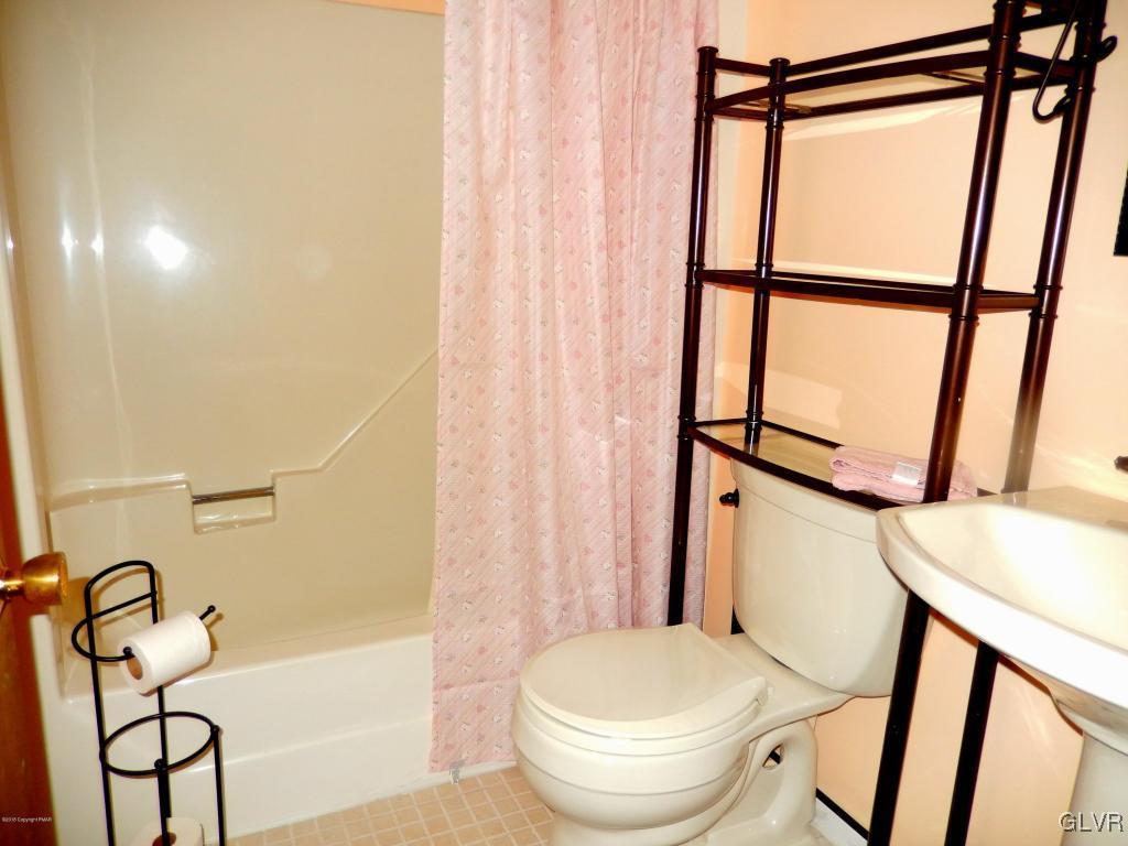 6122 Decker Road Bushkill, PA 18324 - Photo 16 of 33 a bathroom with a toilet and a shower
