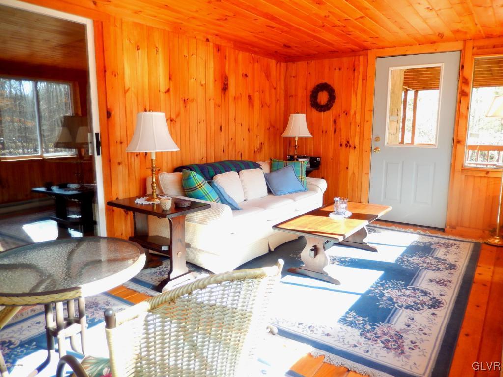 6122 Decker Road Bushkill, PA 18324 - Photo 19 of 33 a living room with patio furniture and a rug