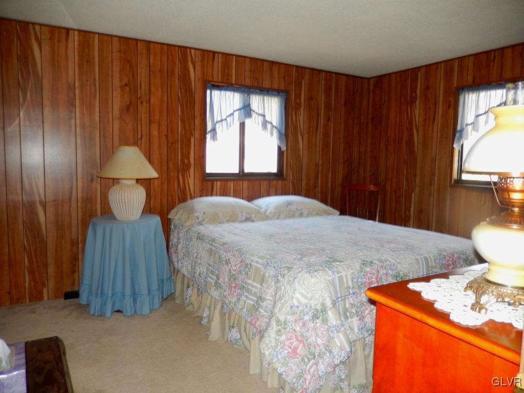6122 Decker Road Bushkill, PA 18324 - Photo 23 of 33 a bedroom with a bed and a window