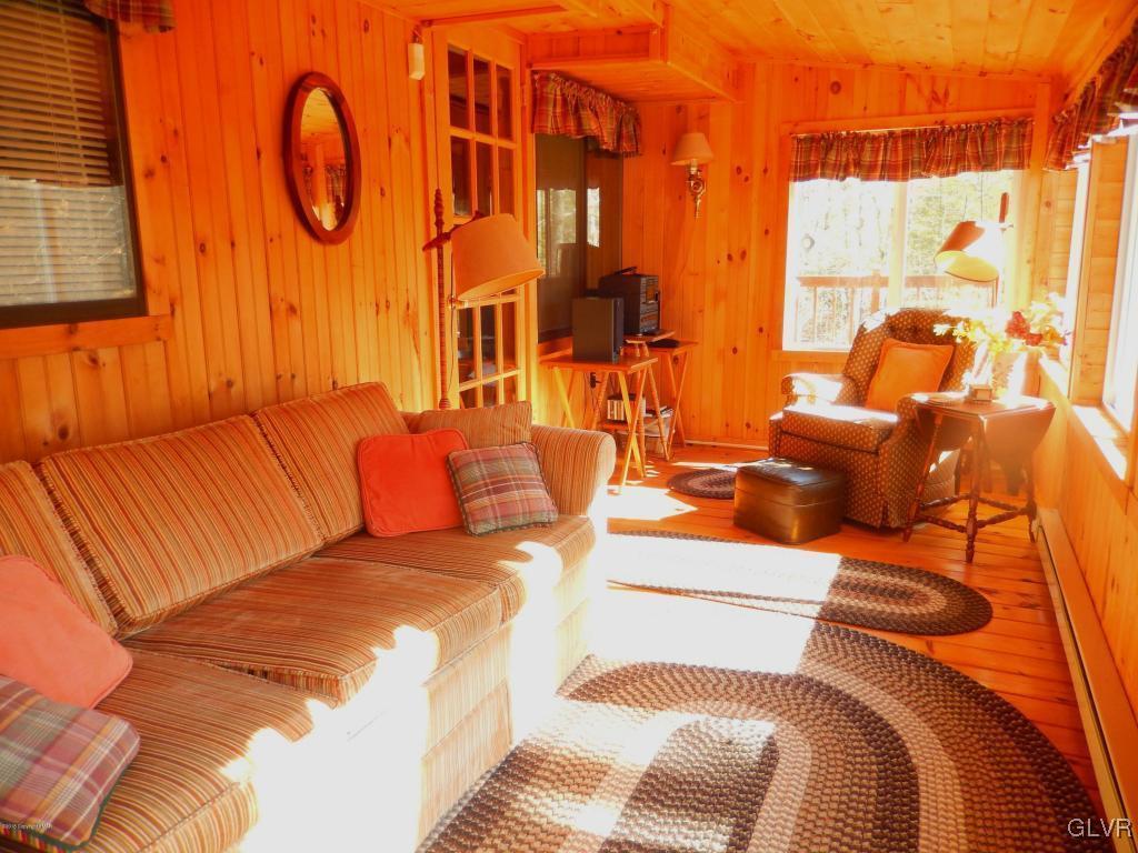 6122 Decker Road Bushkill, PA 18324 - Photo 26 of 33 a living room with furniture and a large mirror