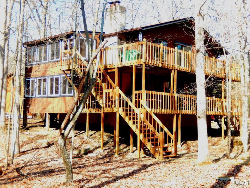 6122 Decker Road Bushkill, PA 18324 - Photo 3 of 33 a view of a house with a wooden deck