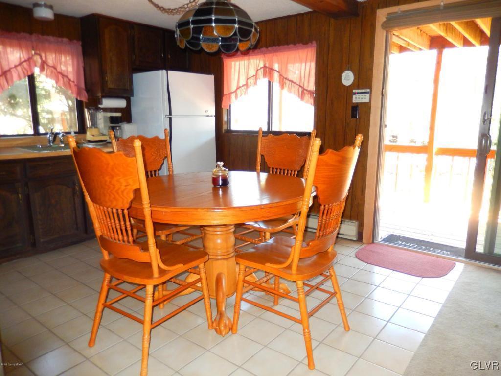 6122 Decker Road Bushkill, PA 18324 - Photo 6 of 33 a dining room table and chairs