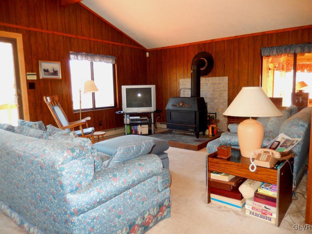 6122 Decker Road Bushkill, PA 18324 - Photo 10 of 33 a living room with furniture a window and a flat screen tv