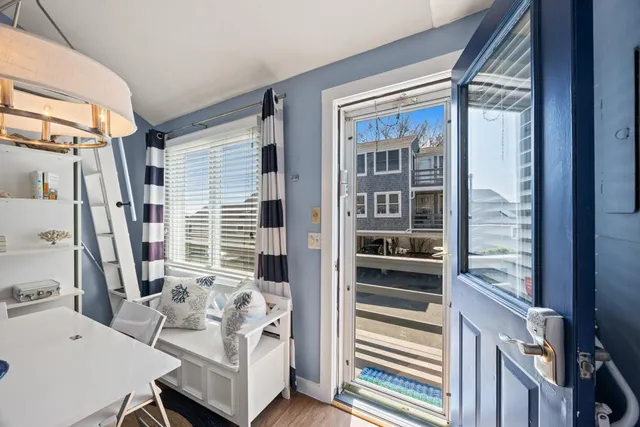 a view of balcony with furniture and front door
