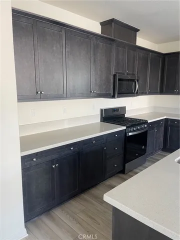 a bathroom with a sink a mirror and a shower