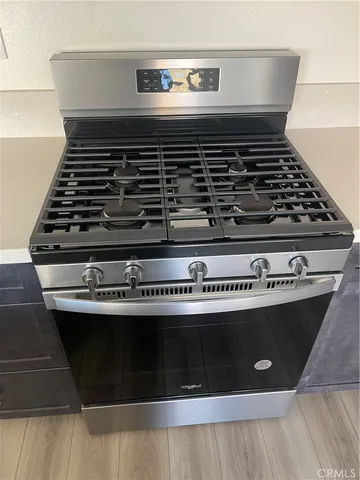 a large kitchen with kitchen island granite countertop a large counter top and a sink