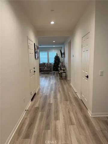 a kitchen with a stove and white cabinets