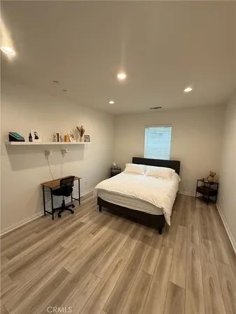 a bedroom with a bed and a table