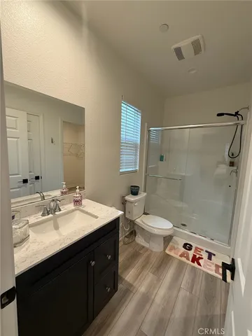 a bedroom with bed and window