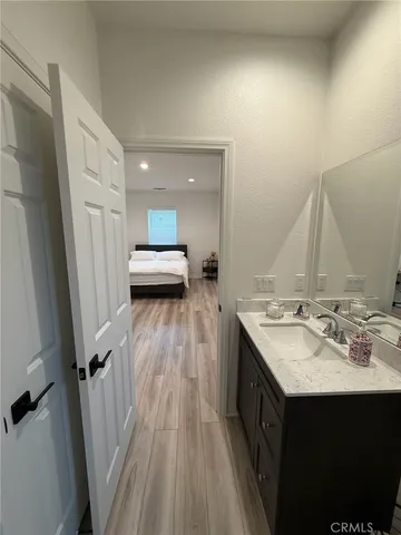 a view of hallway with a bathroom