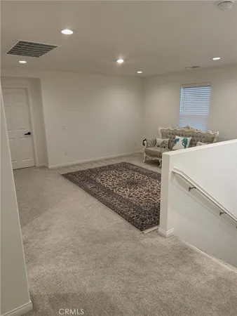 a kitchen with a stove and white cabinets