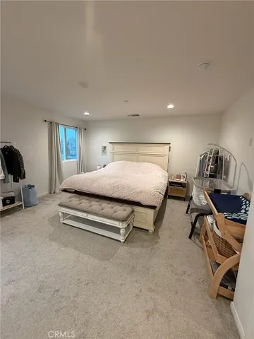 a living room with lots of furniture and a window