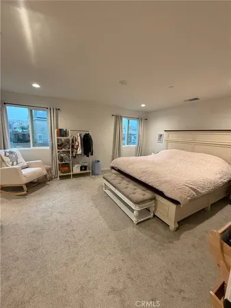 a bed room with furniture and a window