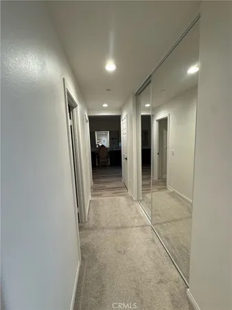 a bathroom with a sink mirror toilet and shower