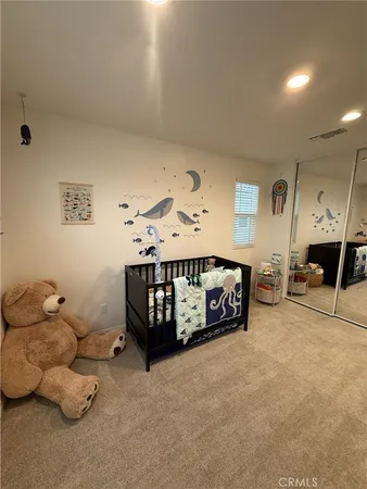 a bathroom with a sink double vanity granite and a mirror