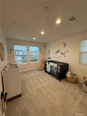 a bathroom with a granite countertop sink a mirror and a bathtub