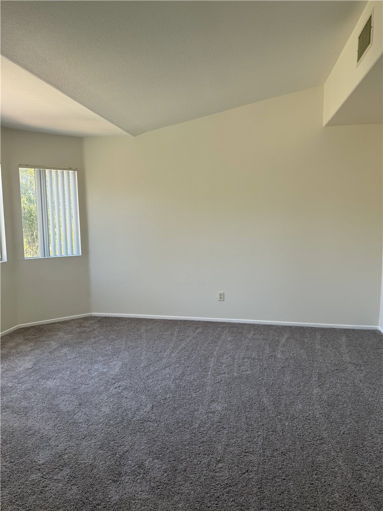 9593 Heartland Place Rancho Cucamonga, CA 91730 - Photo 7 of 13 an empty room with windows