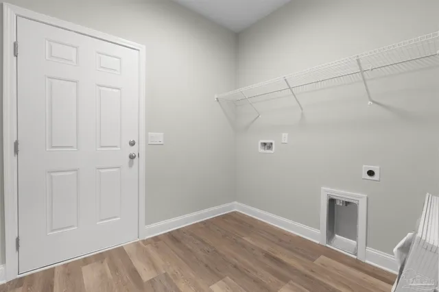 a view of a room with wooden floor