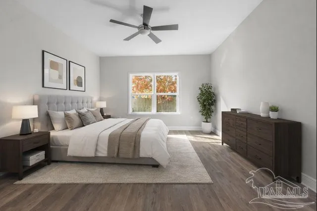 a spacious bedroom with a bed and a window