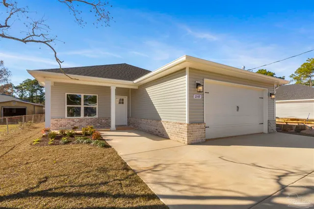 a front view of a house with a outdoor space